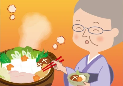 根菜入りの鍋をたべるおばあちゃん