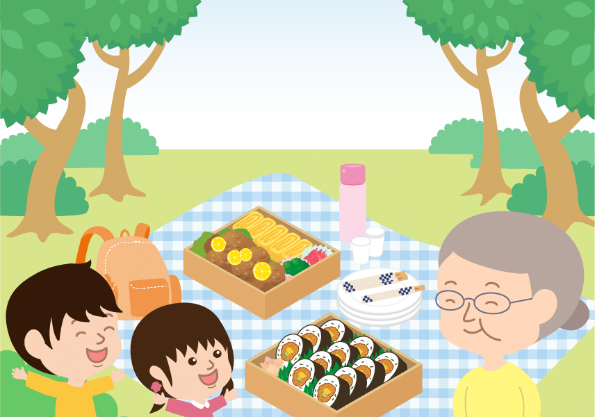 ピクニックでお弁当を楽しむ孫とおばあちゃん